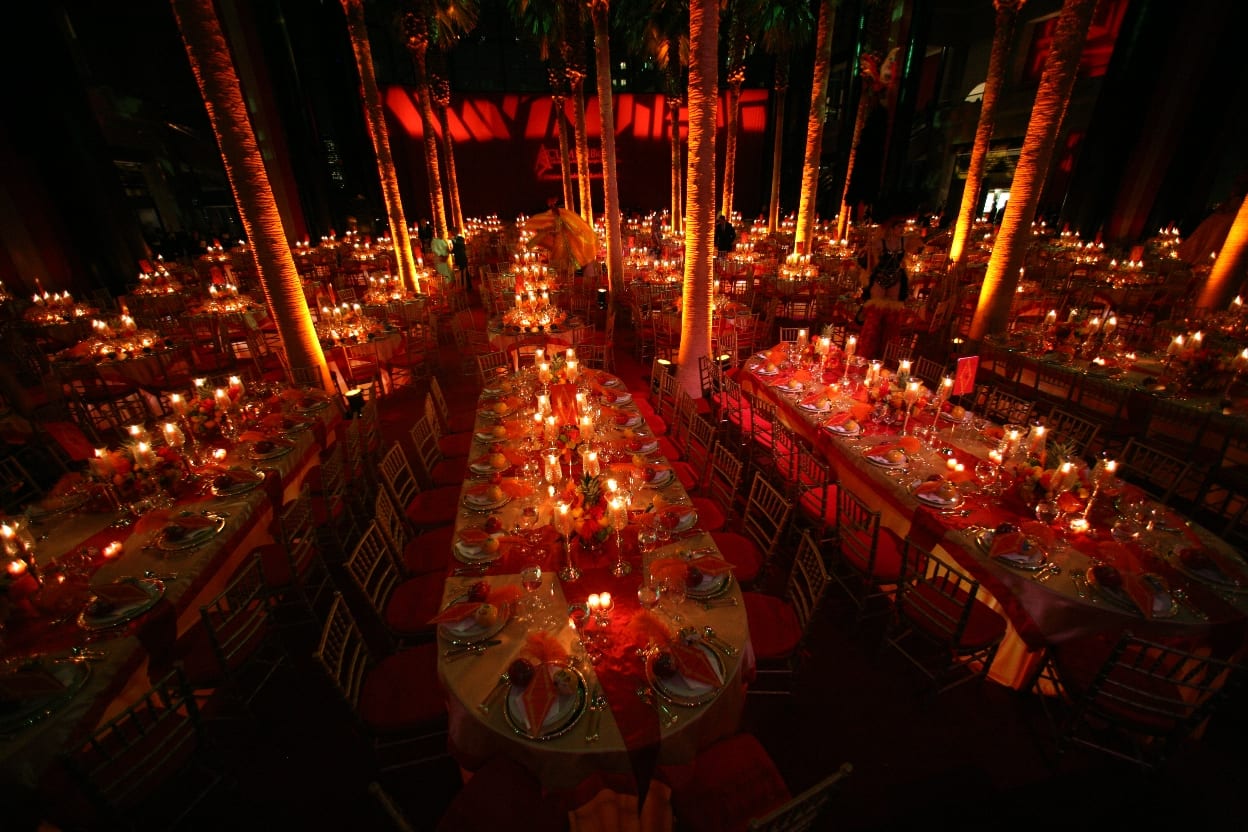 Long dinner tables in a sea of red