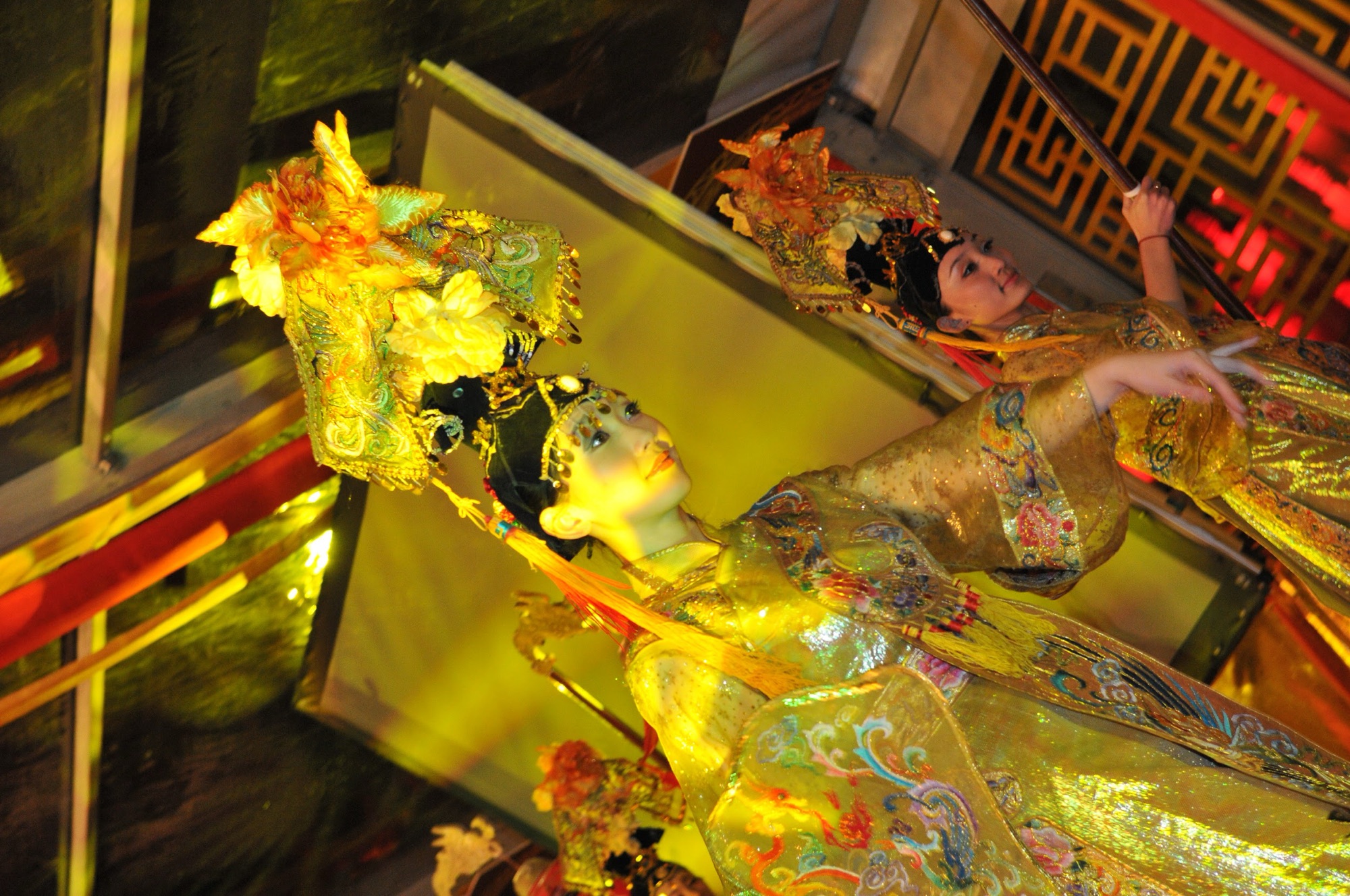A performer in gold during the Thousand Hands show