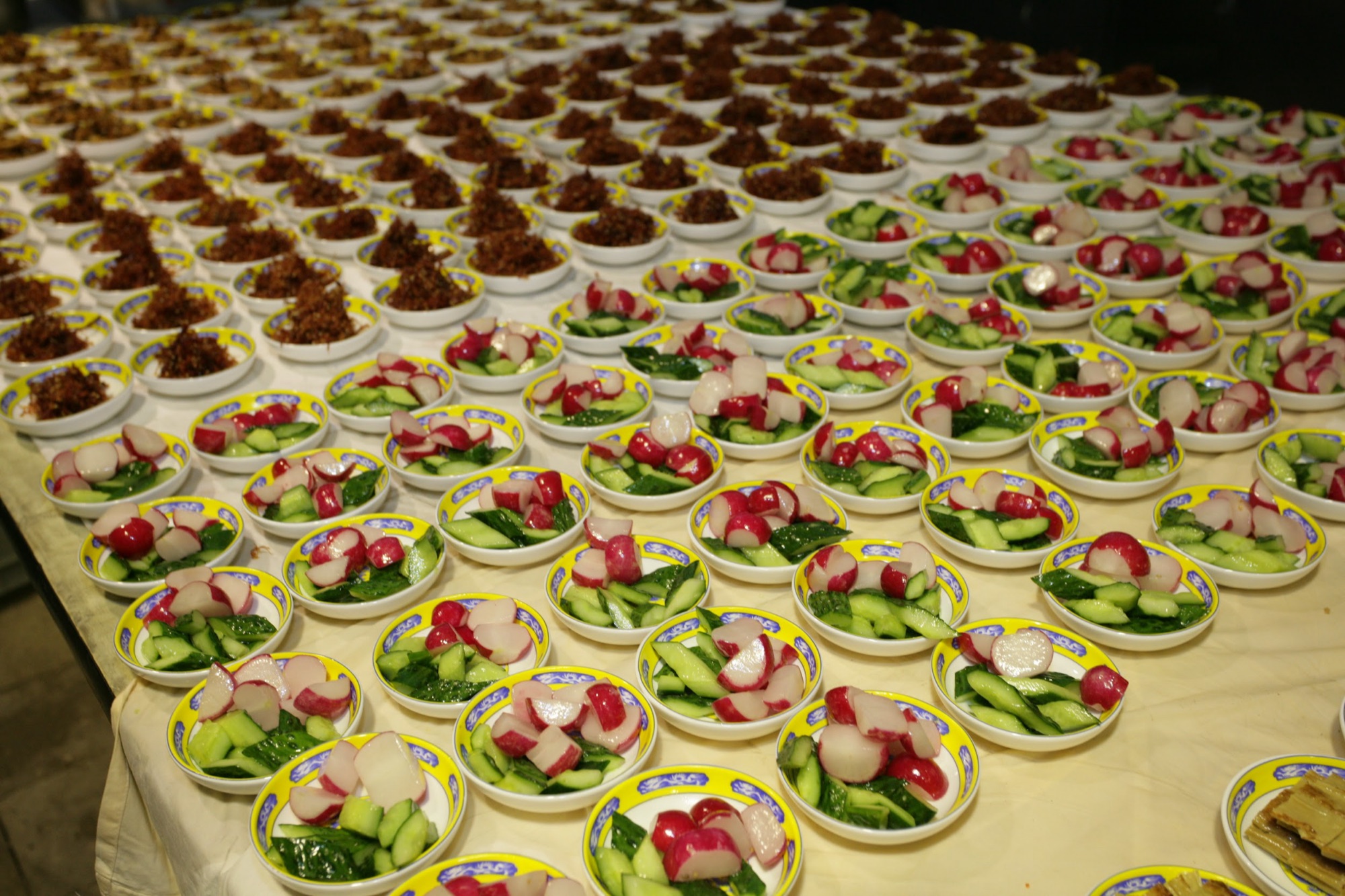 Rows of plated first courses ready for service