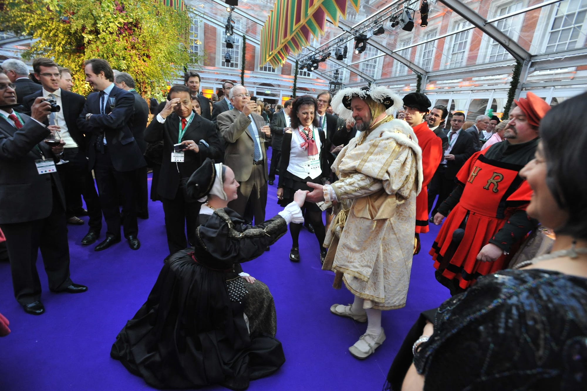 Performers in Tudor dress among the guests