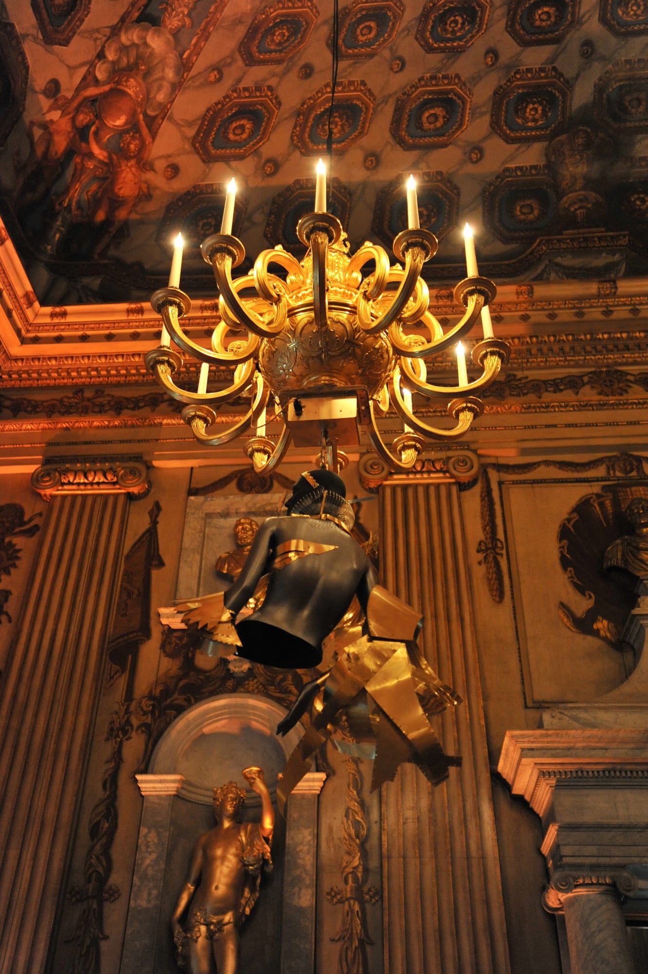 A gilded wall sconce inside the palace