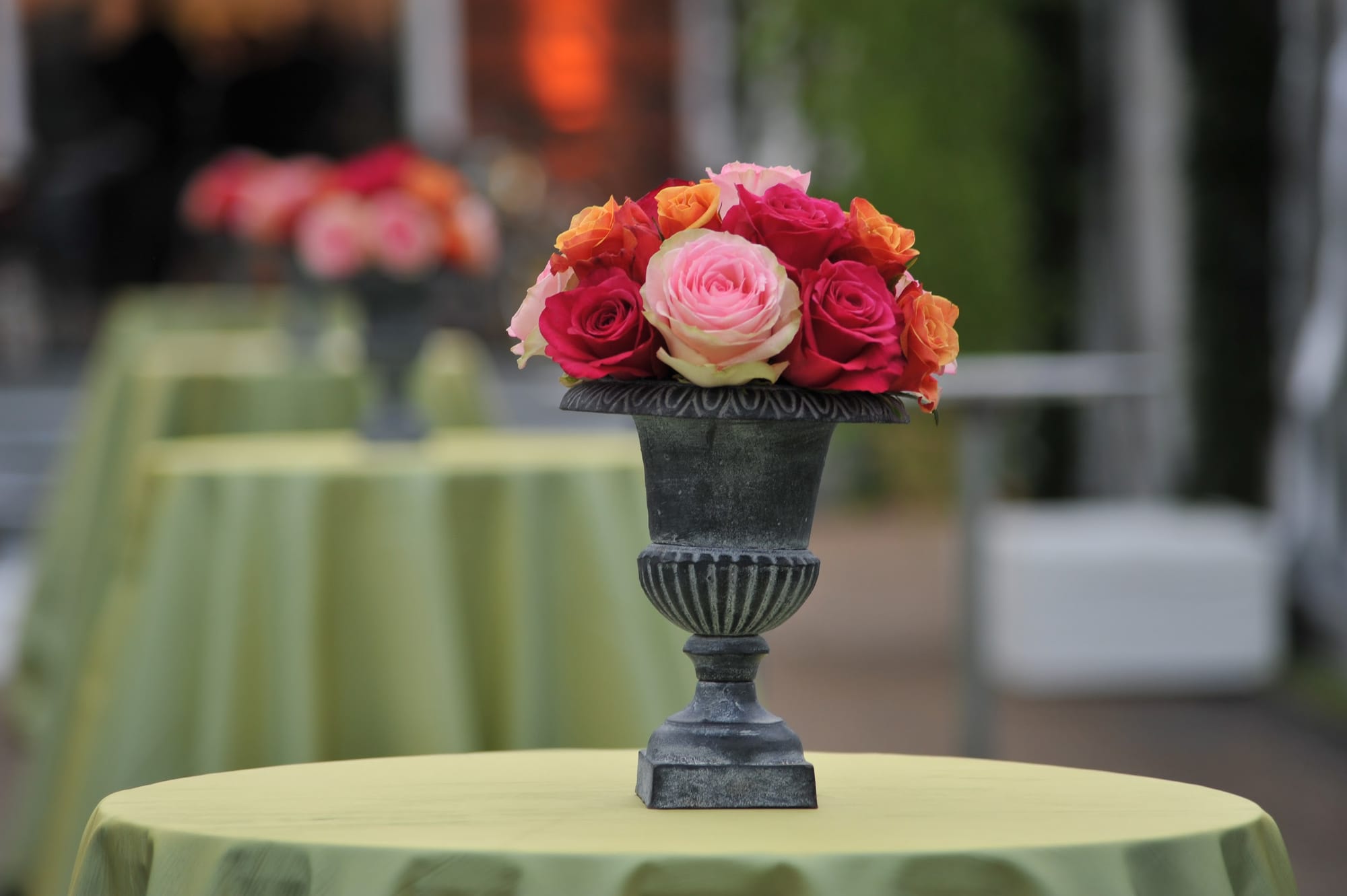 A rose centerpiece in a stone urn