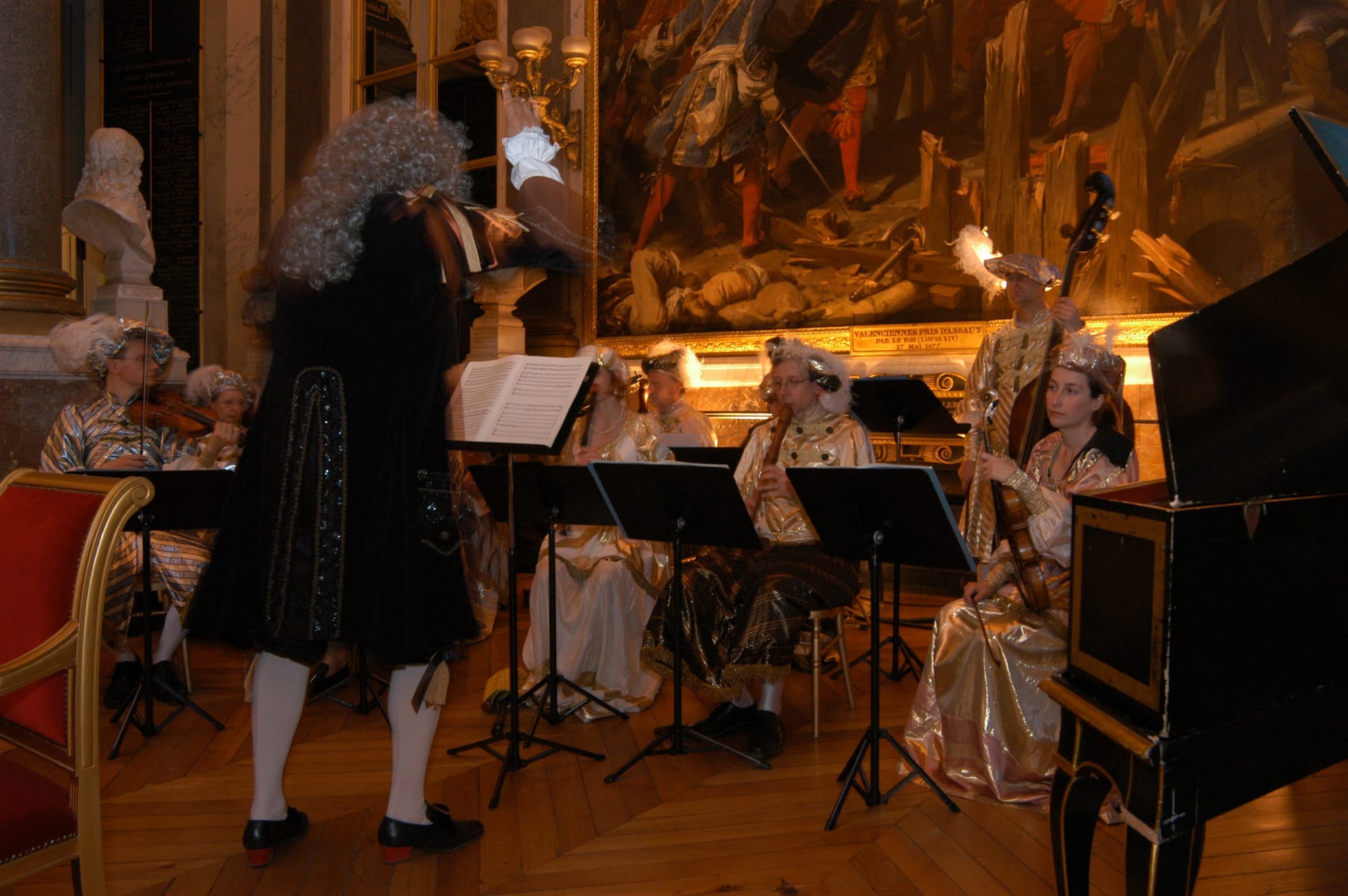 Baroque musicians playing in a gilded salon