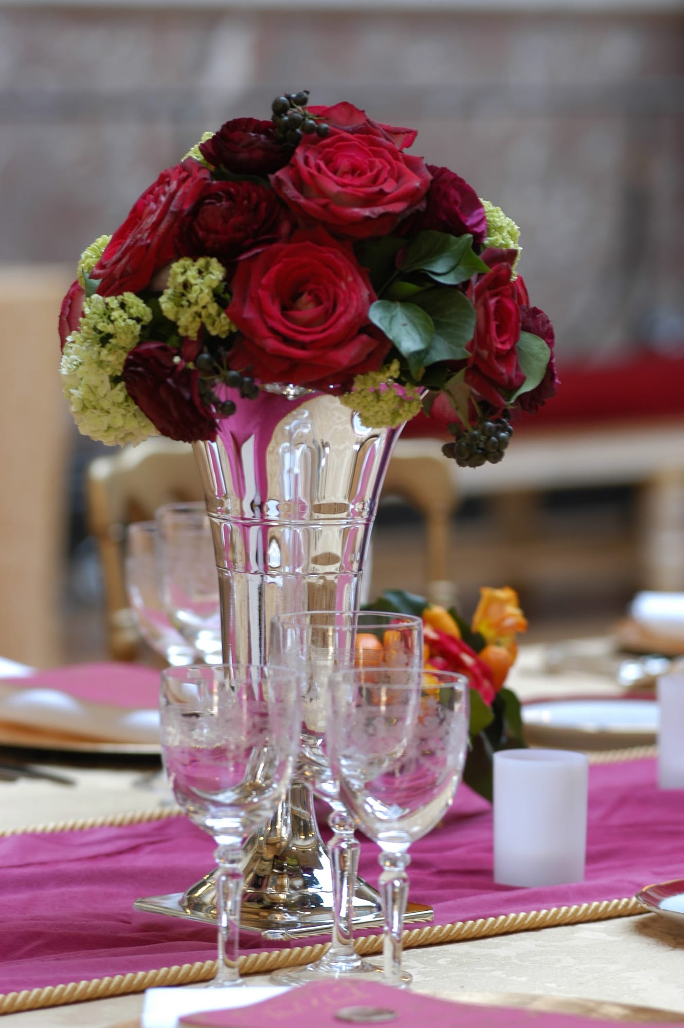 Crystal and red roses on the dinner table