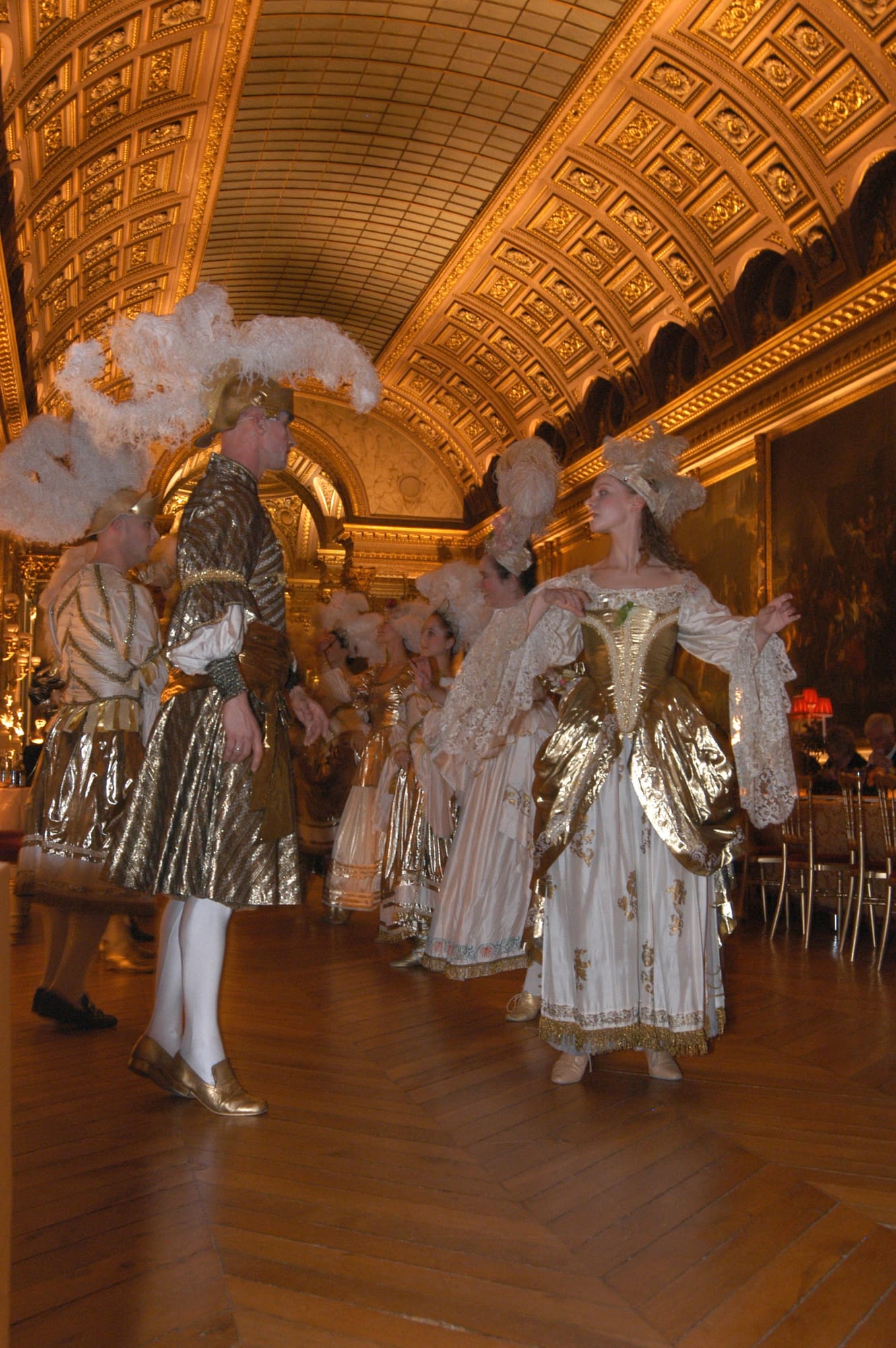Dancers in gold costume in the gallery